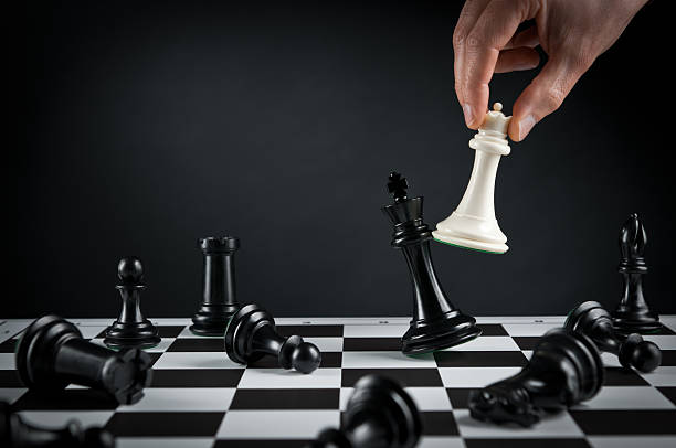 Checkmate strategy, Chess player or businessman making his checkmate move stock photo