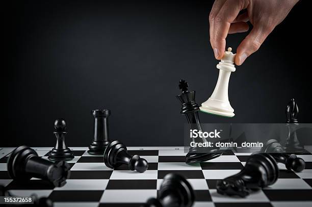 Checkmate Strategy Chess Player Or Businessman Making His Checkmate Move Stock Photo - Download Image Now