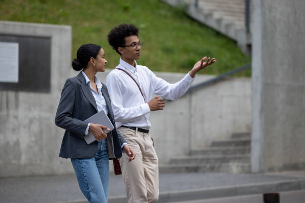 istock Young peopole in the street talking and looking involved 1553726843
