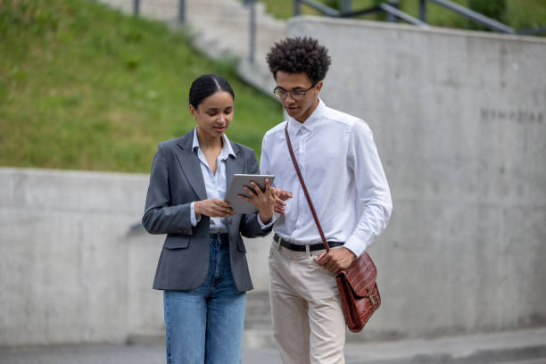 istock Young peopole in the street talking and looking involved 1553726846
