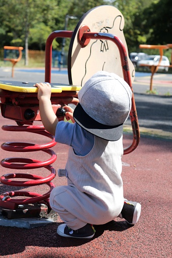 Little boy playing in the playground