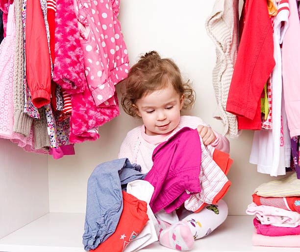 istock Baby girl choosing her clothes 155373293