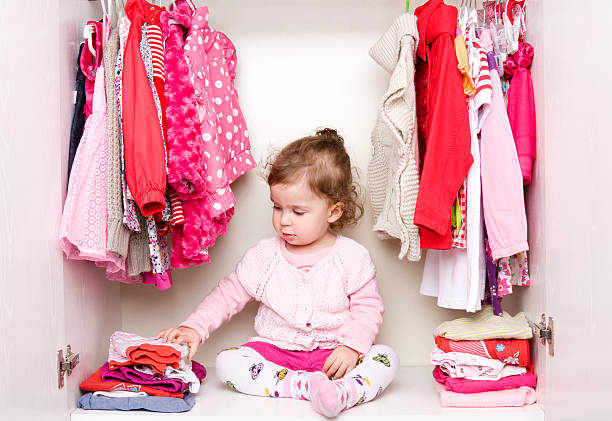 istock Baby girl choosing her clothes 155373296