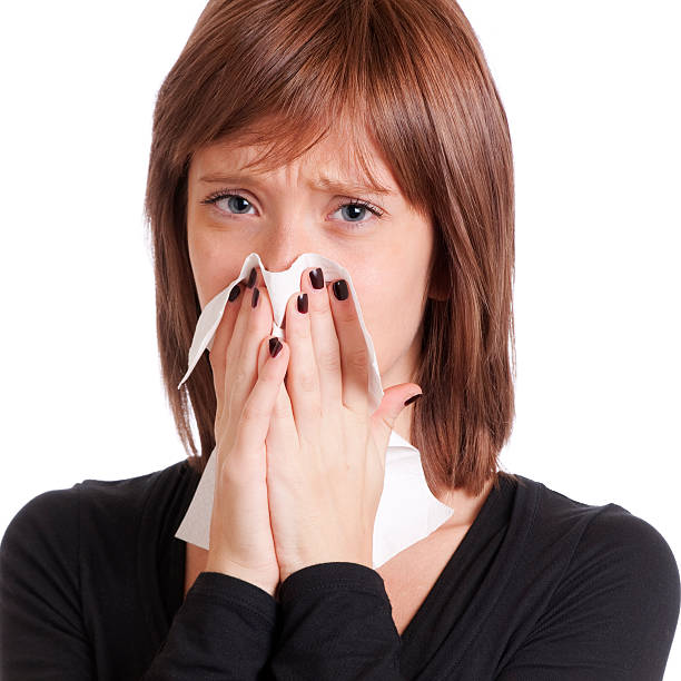 istock Young Woman Blowing her Nose 155373299