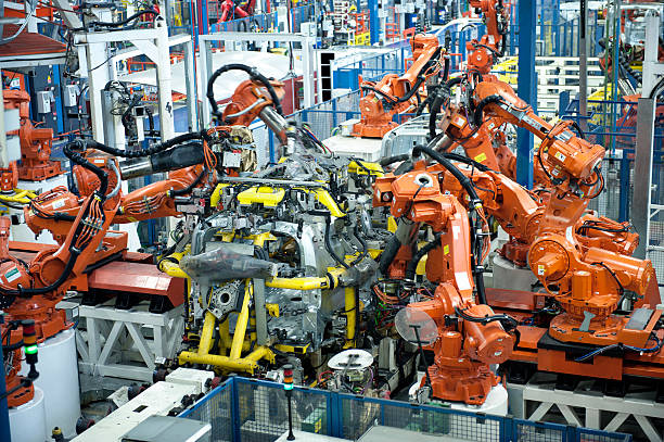 автомобильная промышленность - car industry robot arm car plant стоковые фото и изображения