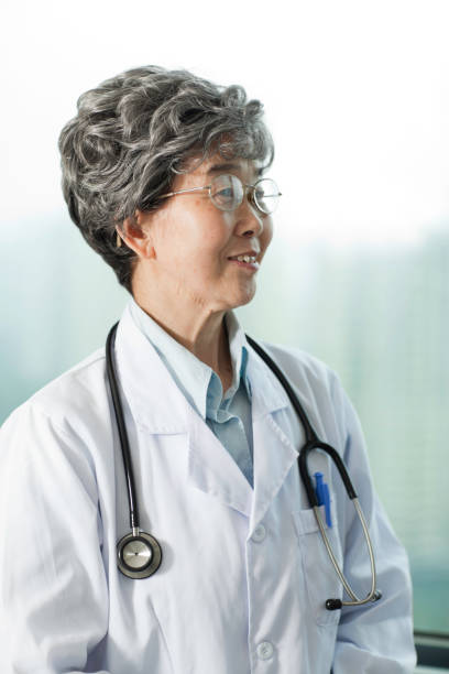 istock Female doctor with stethoscope, smiling 155373637