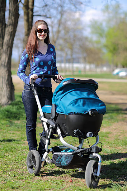 istock Young mother in a park with her baby 155373647