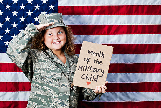 月のミリタリー子 - child military saluting flag ストックフォトと画像