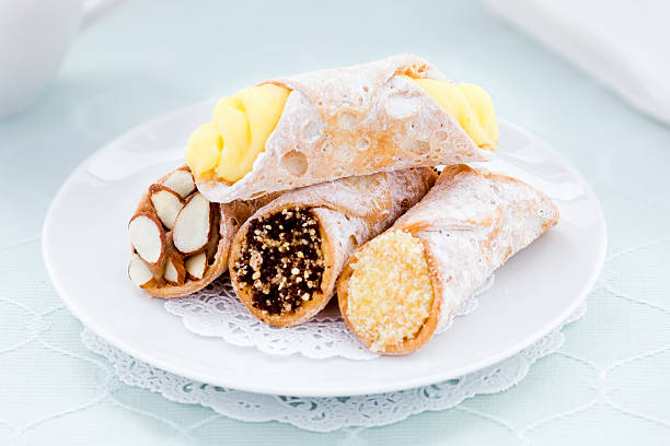 Plate of Cannolis A plate filled with an assortment of cannolis. cannoli photos stock pictures, royalty-free photos & images