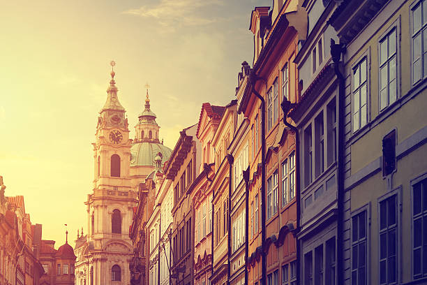Street in Prague with the St. Nicholas Church Street in Prague with the St. Nicholas Church in the background st nicholas church prague stock pictures, royalty-free photos & images