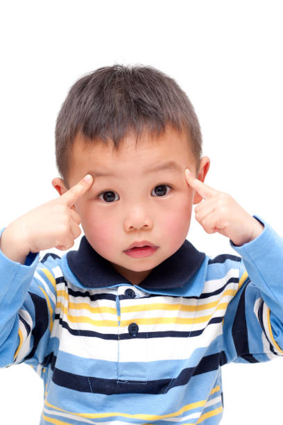 Thoughtful Asian Boy isolated on white background.