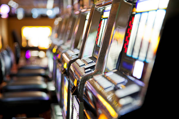 Row of  slot machines in a casino Row of  slot machines in a casino. You might also be interested in these: coin operated stock pictures, royalty-free photos & images