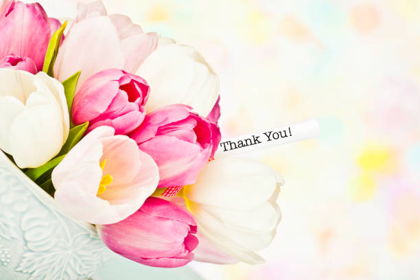 Teacup filled with tulips and thank you message, for mom