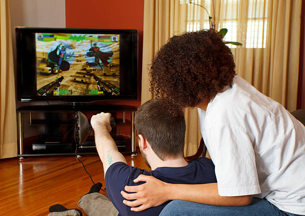 istock Young Couple Playing Video games Together 155374211