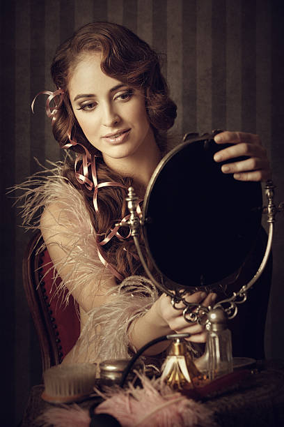 istock retro woman looking at herself in the mirror 155374307