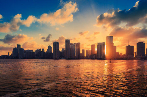 miami skyline in the biscayne bay area at sunset, shoot from a boat coming from the industrial port.