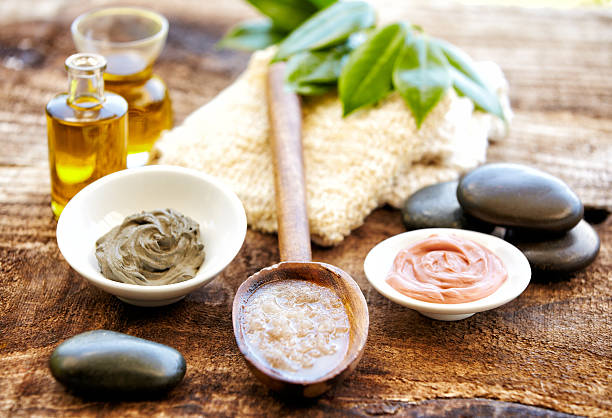 istock Spa still life with mud mask, salt scrubbing, massage oil 155374483