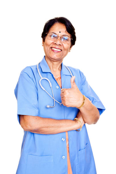 serie alegre india senior mujer médico con mucha suerte - confidence toothy smile thumbs up ok sign fotografías e imágenes de stock