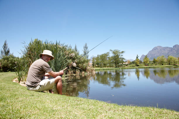 istock Man fishing at a lake 155375034