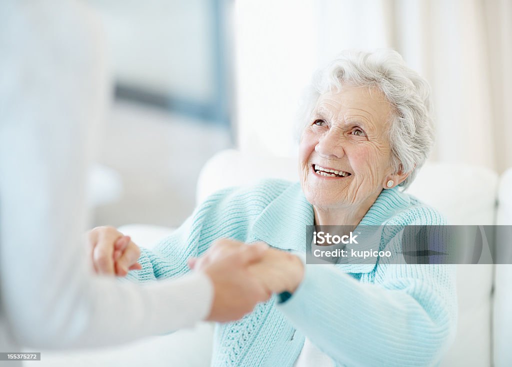 Devoted care and assistance  Senior Adult Stock Photo