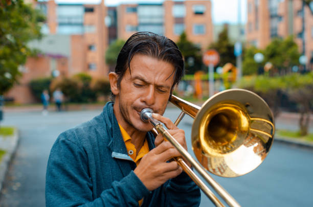 istock Street musician playing trombone and copy space 1553753204