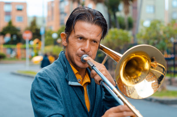 istock Street musician playing trombone and copy space 1553753707
