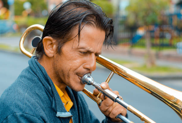 istock Street musician playing trombone and copy space 1553753712