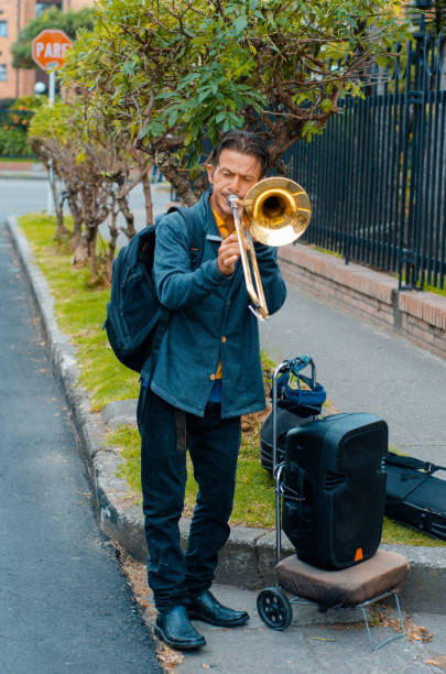 istock Street musician playing trombone and copy space 1553753715