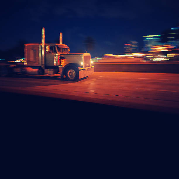 istock semi-truck at night 155375551