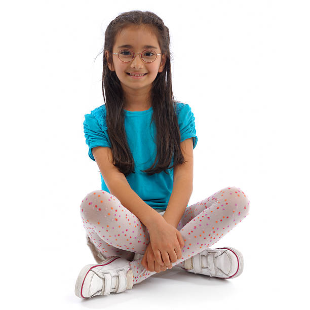 Smiling little girl  cross legged stock pictures, royalty-free photos & images