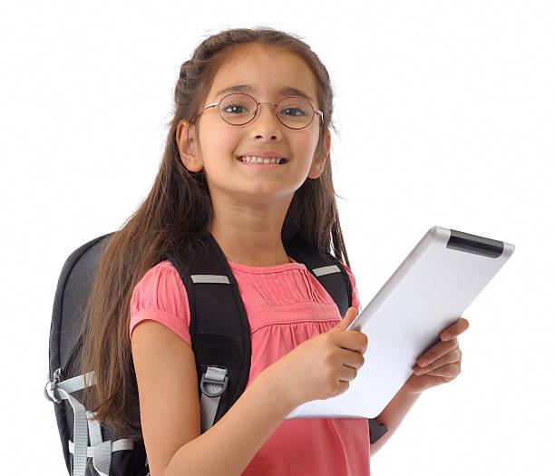 Little girl holding a tablet pc. Isolated on white.