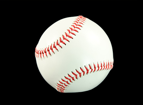 A new baseball on a black background .. close-up. Copy space