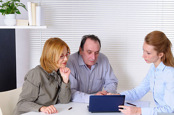 istock Mature Couple and Financial Advisor 155376161