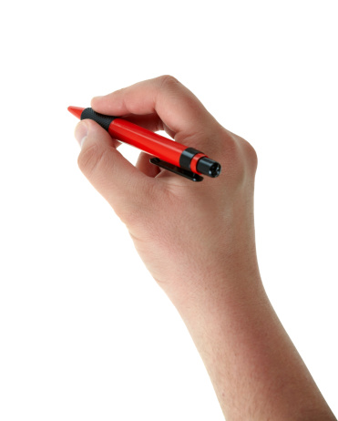 Writing male hand with red pen on white