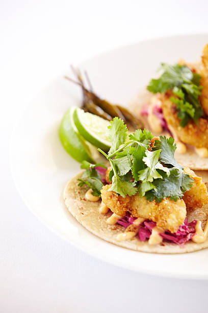 istock Close up of fish tacos on a plate 155376313