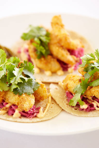 istock Close up of fish tacos on a plate 155376315