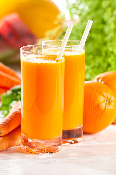 istock Two glasses with orange and carrot juice 155376413
