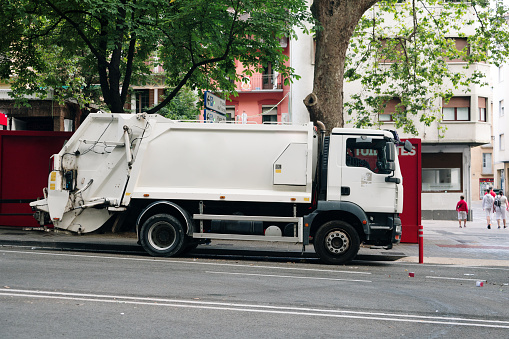 A garbage truck in a city
