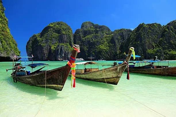 Long tail wooden boats moored at Maya Bay-Phi Phi Islands-Thailand