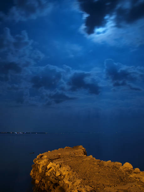 istock Moonshine seascape and old pier 155377126