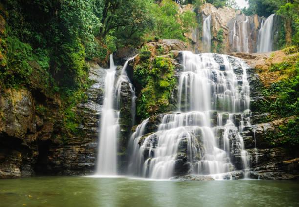 The beautiful Nauyuca Waterfall in the Costa Ballena near Dominical, Costa Rica (sometimes referred to as Santo Cristo Falls).