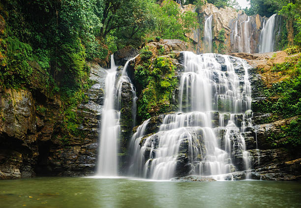 Nauyuca Waterfall in Costa Rica The beautiful Nauyuca Waterfall in the Costa Ballena near Dominical, Costa Rica (sometimes referred to as Santo Cristo Falls). costa rica photos stock pictures, royalty-free photos & images