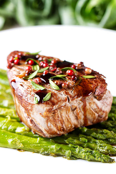 Beef fillet with pink pepper and asparagus.