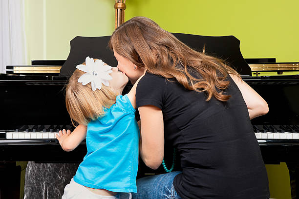 Piano Lessons - Mother and Daughter stock photo