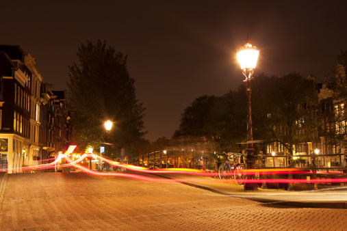 Street lamp at night with car light trails, Amsterdam, The Netherlands