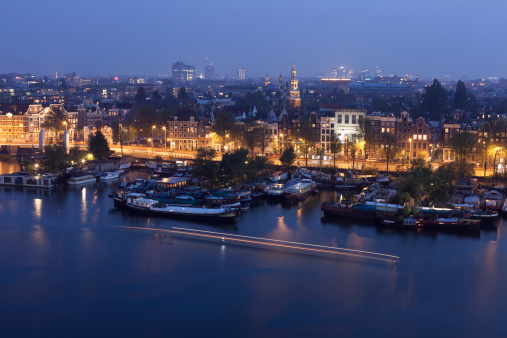 Aerial view of city harbour at night, Amsterdam, The Netherlands