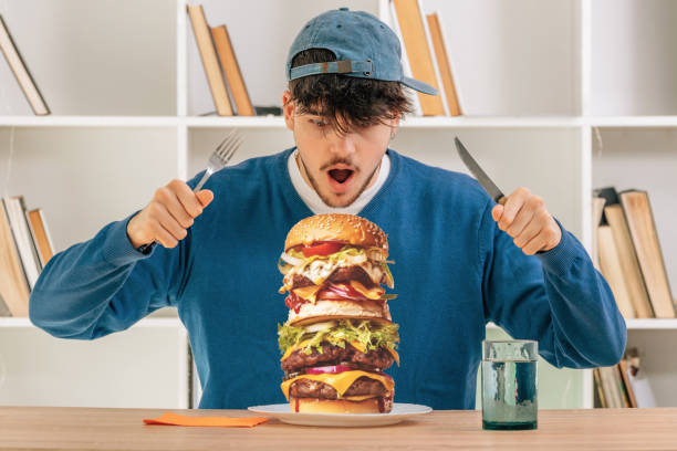 boy eating hamburger, fast food