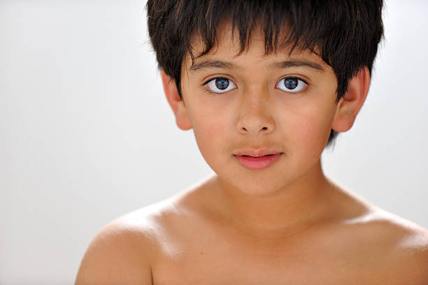 Frontal headshot of mixed-race ten year old boy.