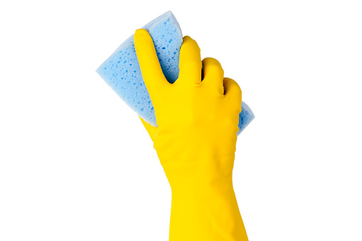 Hand in yellow glove with sponge isolated on white background