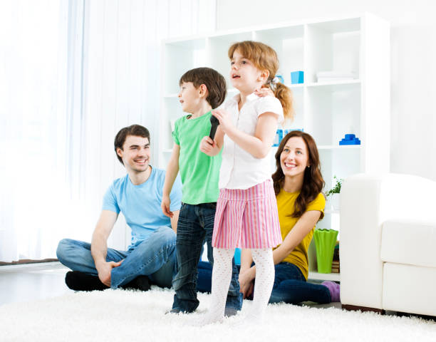 istock Family Having fun with karaoke 155378040